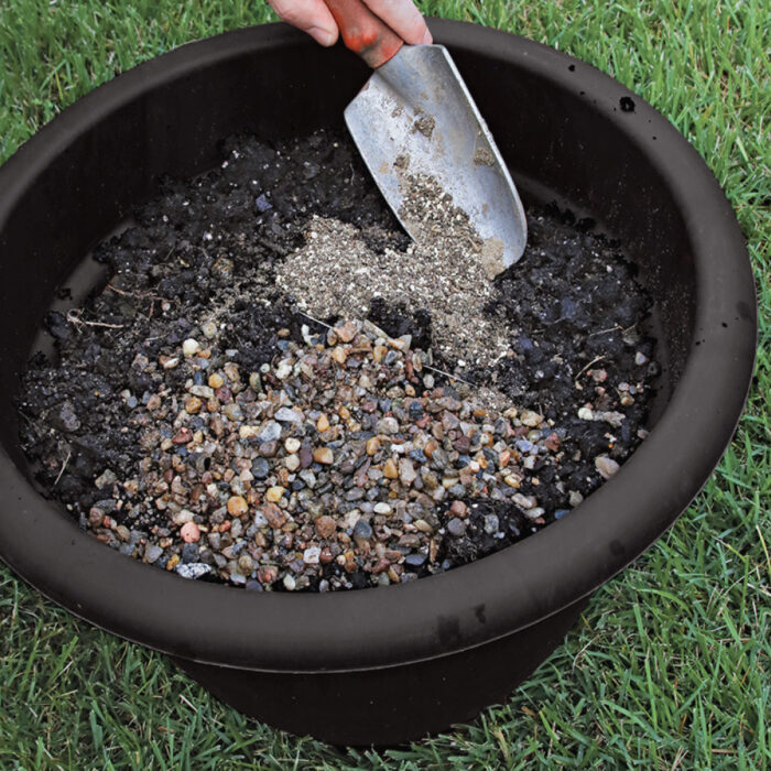 mixing gravel and fertilizer into potting soil